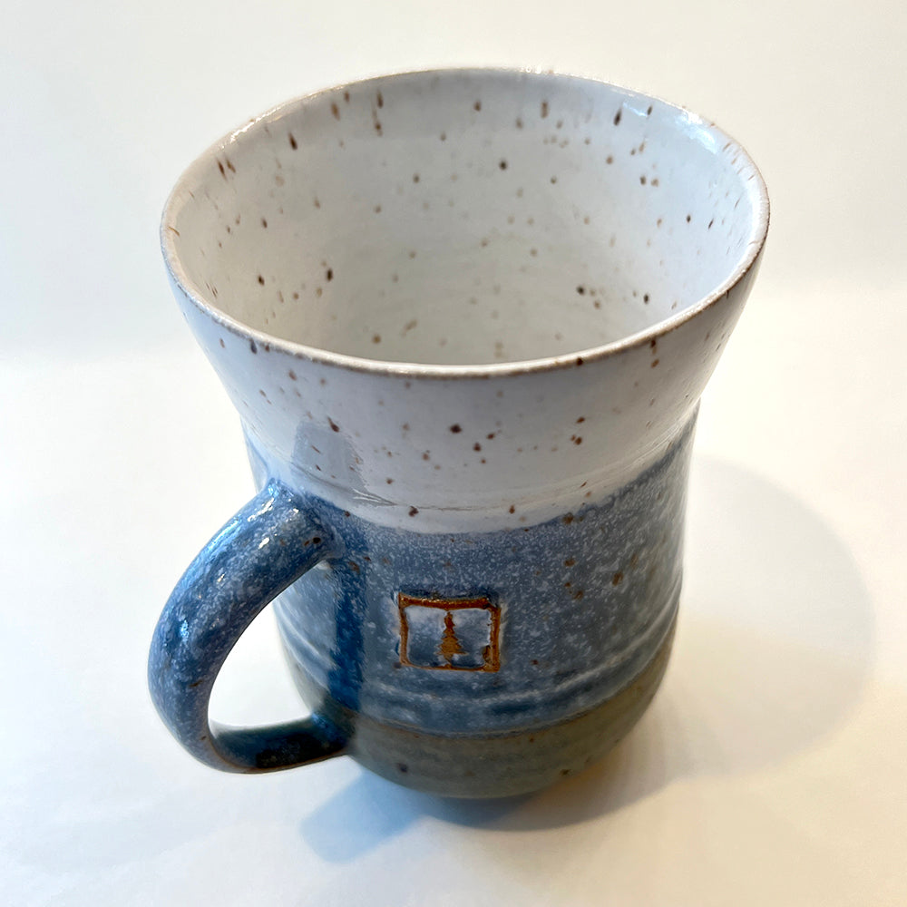 top view photo of handmade pottery mug for the round pond getaway, with white, blue and grey glazes