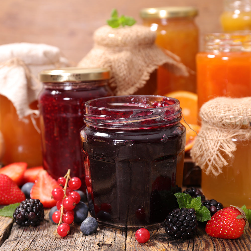 color photograph of homemade jams in glass jars