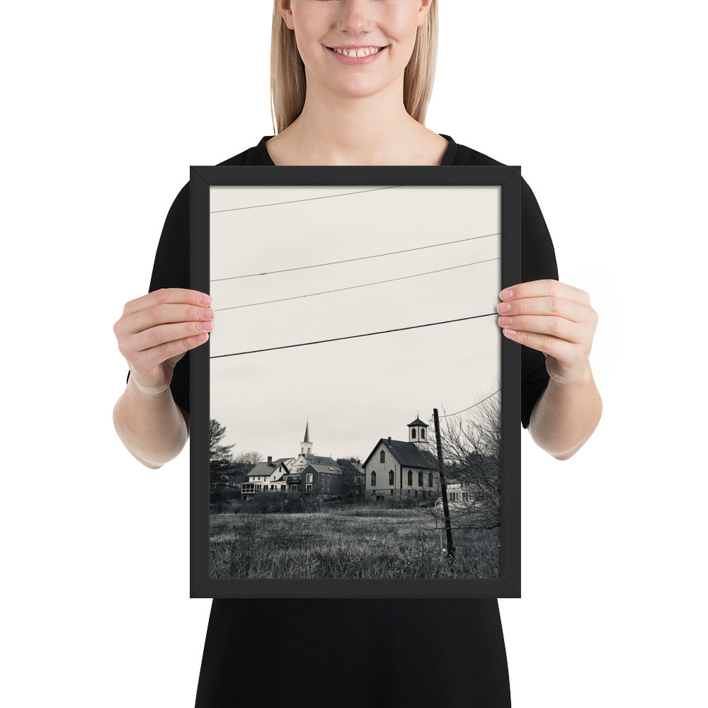 photo of a woman holding a black and white photograph of the little brown church, round pond maine