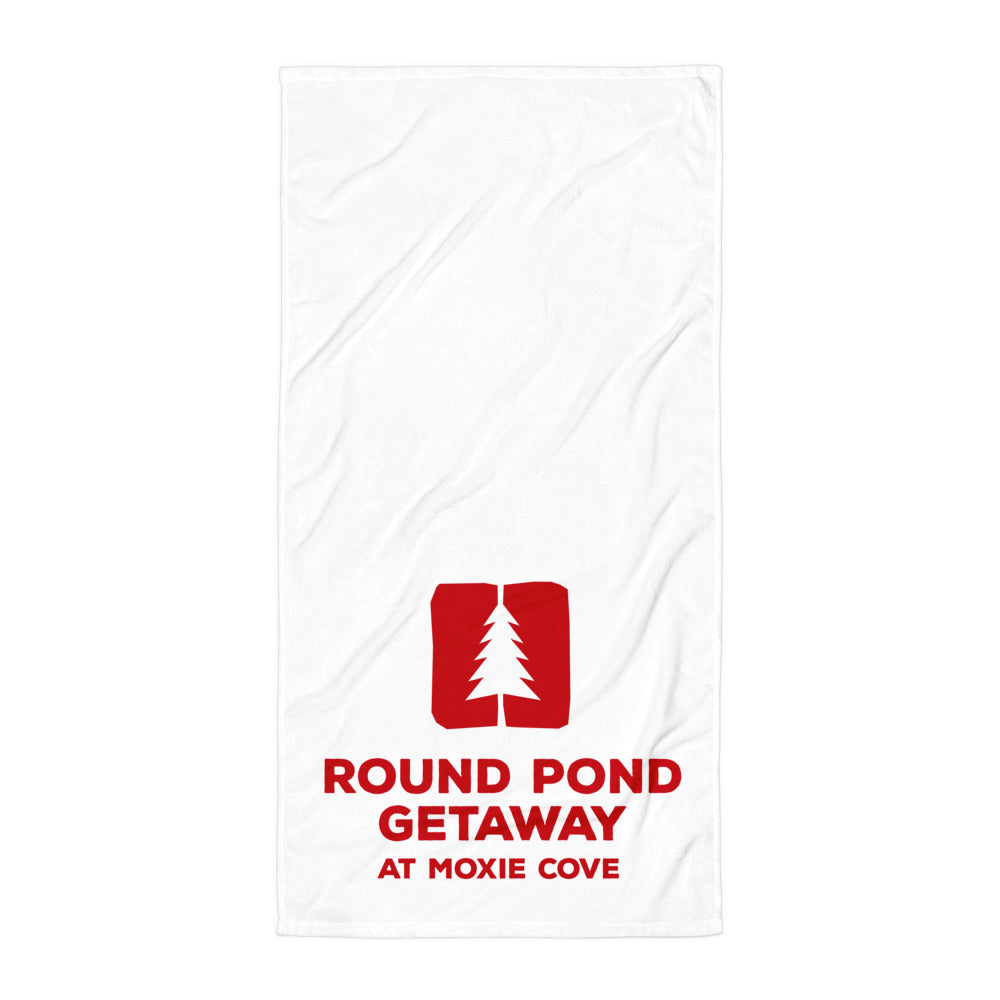 white towel with the round pond getaway logo printed in red