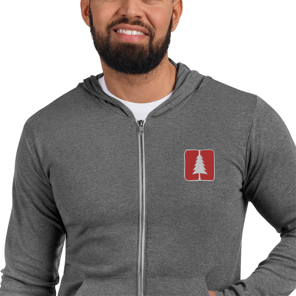 man wearing grey zip hoodie with the round pond getaway at moxie cove logo embroidered in red and white thread on the left chest