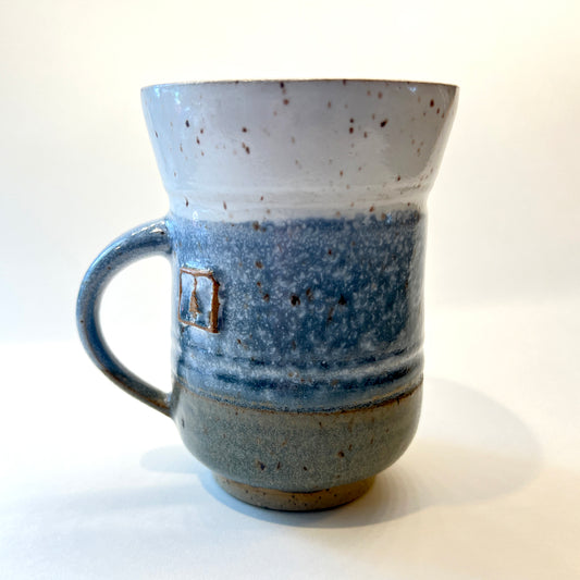 photo of handmade pottery mug for the round pond getaway, with white, blue and grey glazes