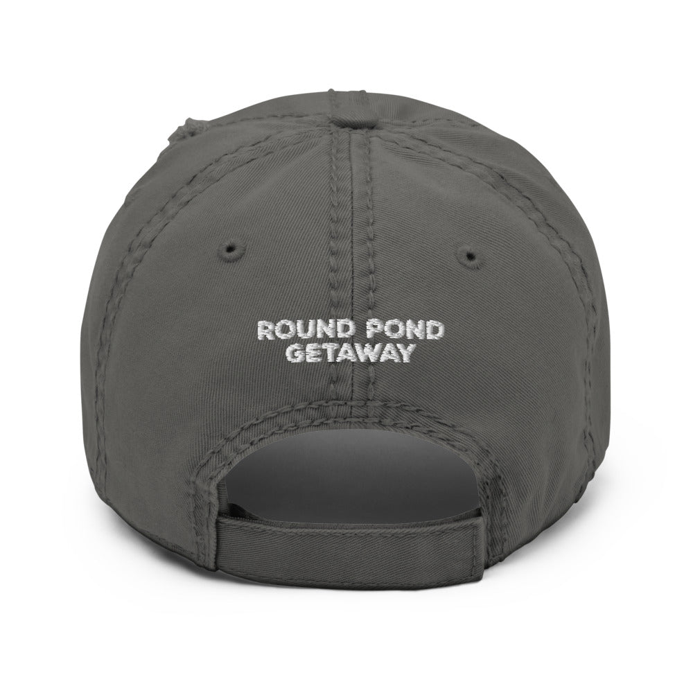 grey distressed baseball hat with round pond getaway word logo embroidered in white.