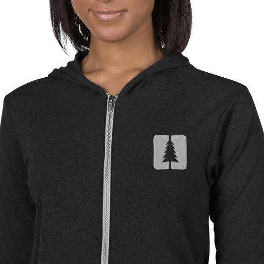 woman wearing black zip hoodie with the round pond getaway at moxie cove logo embroidered in white thread on the left chest